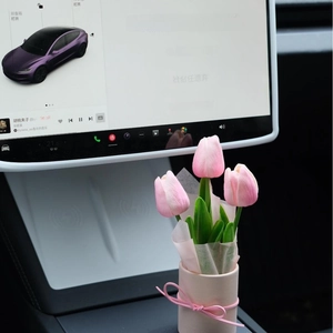 Pink artificial tulip bouquet in a matching bucket for car interior decoration