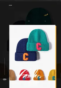 Detailed close-up of knitted winter beanie featuring textured C letter embroidery patch