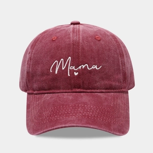 Close-up of Mama embroidery and heart detail on washed burgundy cotton baseball cap