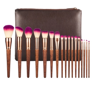 Detail view of 16-piece makeup brush set with wooden handles and purple gradient bristles