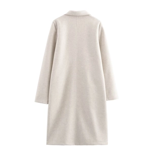 Close-up of oatmeal wool coat back showing high-quality fabric texture and seam detail