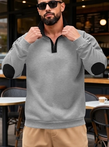 Detailed view of grey sweatshirt showing black stand collar and oval elbow patch contrast