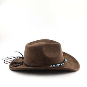 Detail of brown suede western cowboy hat featuring turquoise beads and metal studs