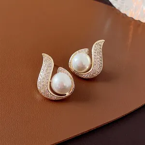 Elegant gold plated mermaid pearl stud earrings with sparkling cubic zirconia accents