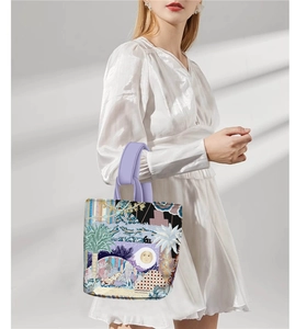 Close-up of Van Gogh oil painting style tote bag with purple handles and palm patterns