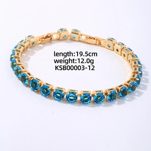 Detail of golden tennis bracelet with sky blue zircons measuring 19.5cm and 12.0g