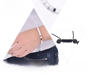Detail view of Morse code bracelet with white turquoise beads and adjustable woven cord