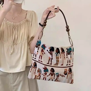 Vintage Egyptian jacquard tote bag with wooden bead straps and pharaoh mural patterns