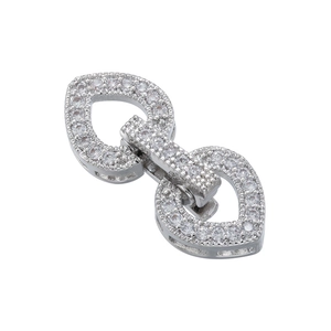 Macro view of silver-plated heart clasp with shimmering cubic zirconia for jewelry making