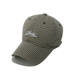 Detailed embroidery of cursive Danke text on vintage plaid baseball cap fabric