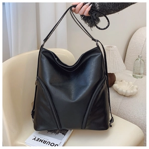 Detail view of the black textured PU leather hobo bag with decorative double front zippers