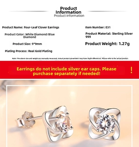 Detail of S999 sterling silver four-leaf clover earrings with sparkling cubic zirconia