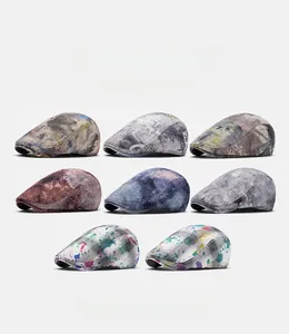 Matrix display of eight American tie-dye berets with vintage graffiti and splatter paint patterns