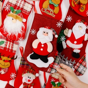 Festive Christmas stockings with Santa and reindeer appliques for holiday tree decoration