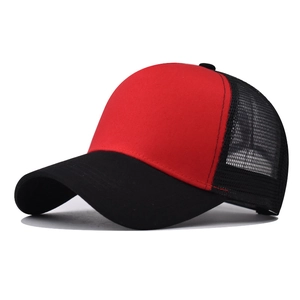 Detail of red cotton front panel and black breathable mesh on trucker baseball cap