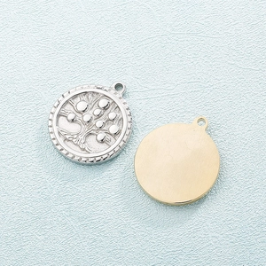 Golden and silver tree of life pendants in stainless steel with gear-like edge details