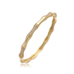 Luxurious 18K gold-plated bamboo joint bangle with sparkling zircon micro-inlay on white background