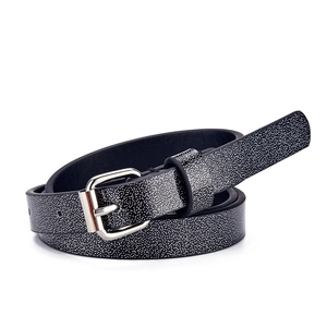 Kids black glitter belt with silver heart buckle and white dots on white background