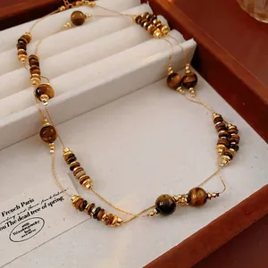 Collier double rang vintage style Maillard avec perles d'œil de tigre et de métal doré