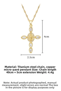 Detailed specs of gold titanium cross pendant with marquise zircon and religious relief