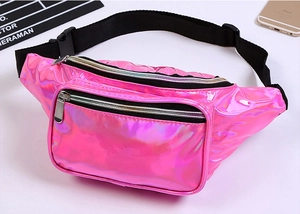 Macro shot of pink holographic PVC fanny pack with dual zip pockets and nylon strap