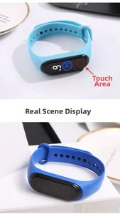 Detail view of the black LED touch screen area on blue silicone waterproof smart bracelet