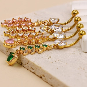 Detail of hollow heart belly rings with colorful marquise zircon and gold plating