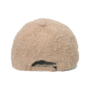 Detail of camel plush baseball cap back with adjustable strap and sherpa texture