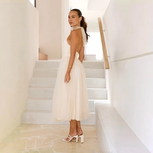 Elegant off-white halter neck mesh midi dress with backless design and layered skirt
