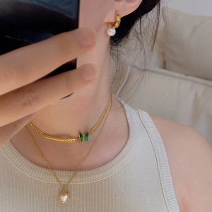 Gold choker with green butterfly charm and pearl heart necklace set for women