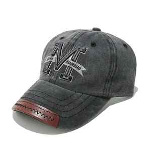 Retro washed cotton baseball cap in charcoal gray with M letter embroidery and leather brim