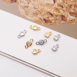 Close-up of gold and silver plated 925 sterling silver charms with zircon for DIY jewelry