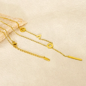 Elegant gold stainless steel LOVE letter necklace with a sleek vertical bar pendant