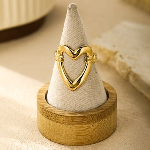18K gold plated stainless steel open ring with cutout heart design on display stand