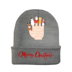 Close-up of grey ribbed knit hat featuring festive cartoon prints and Christmas greetings