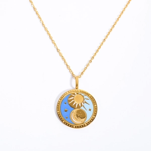 Golden tarot sun and moon medallion necklace with blue enamel on a minimalist gold chain