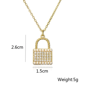 Detailed view of gold plated padlock pendant with pearls and crystals 2.6cm x 1.5cm