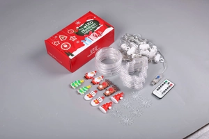 Flat lay of Christmas LED light set with USB copper wire and festive ornaments