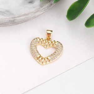 Detail of gold-plated evil eye heart pendant with colorful stones and clear crystals
