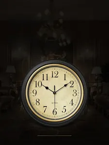 Close-up of vintage European wall clock with golden inner rim and silent quartz movement