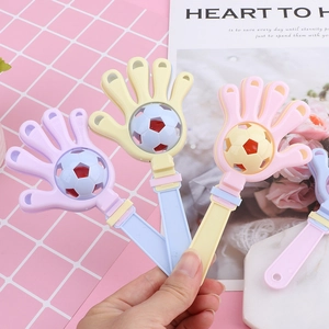 Creative macaron-colored hand clapper toy for babies featuring a mini rotating soccer ball