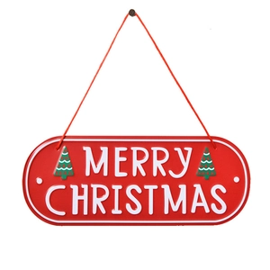 Red metal Merry Christmas oval door sign with white lettering and green trees