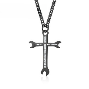 Detail of black cross wrench necklace with engraved inspirational scripture on white background