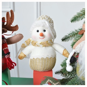Close-up of a festive snowman plush toy with gold glitter scarf and knit hat ornament
