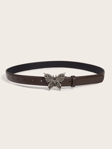 Detail of vintage butterfly metal buckle on dark brown leather belt for women