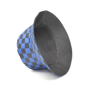 Detailed view of the blue checkerboard pattern and smiley face print on the bucket hat