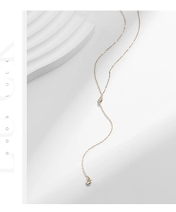 Detailed view of 925 sterling silver Y-shaped necklace with sparkling zircon pendants
