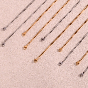 Detail of 18K gold and silver stainless steel box chains with lobster clasps