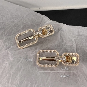 Golden alloy hair clips with pearls and rhinestones shown with detailed measurements