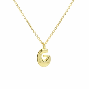 Macro detail of puffy bubble letter G pendant with glossy 18k gold plated finish